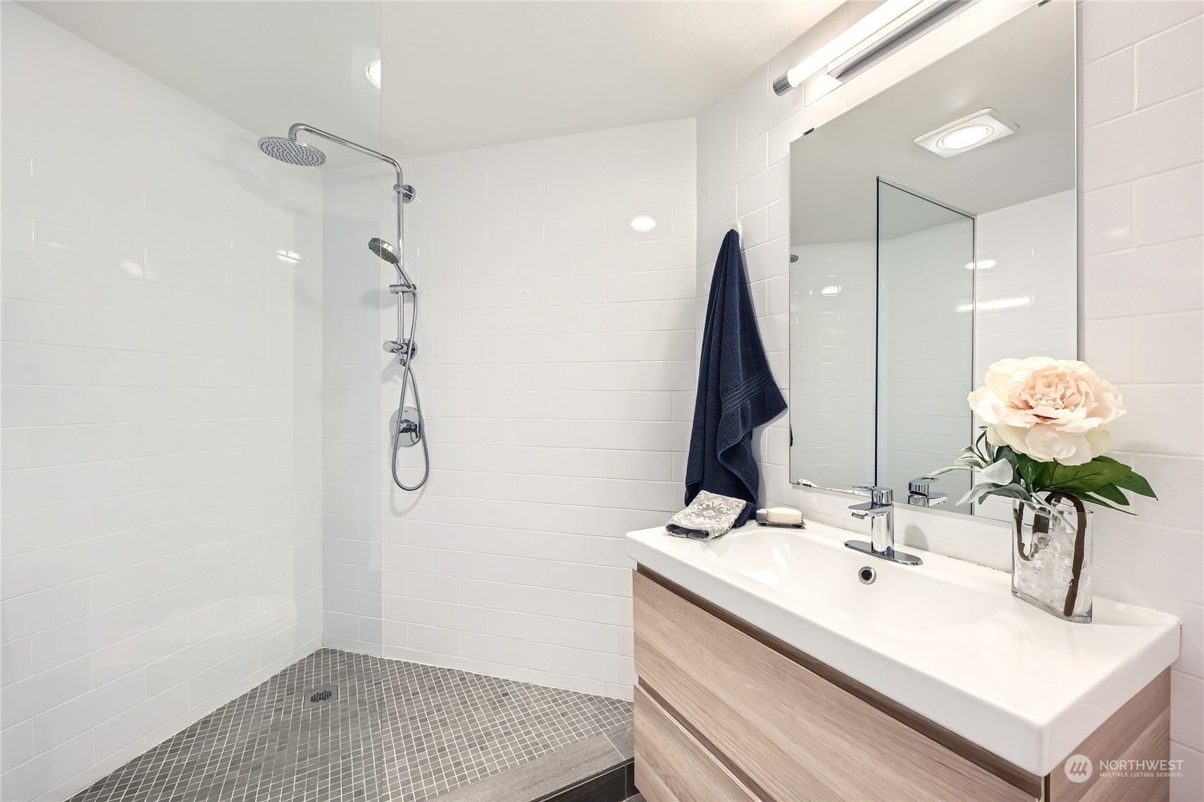 619 5th Avenue West, Unit 401 Seattle, WA 98119 - Photo 20 of 29 a bathroom with a sink and a mirror