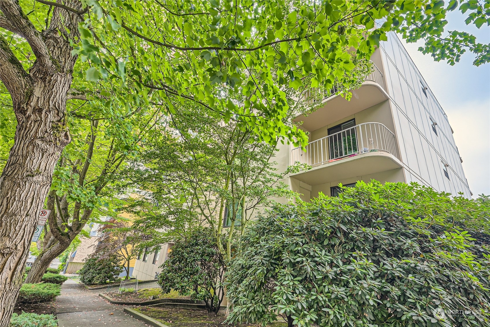 619 5th Avenue West, Unit 401 Seattle, WA 98119 - Photo 28 of 29 front view of a house with a tree