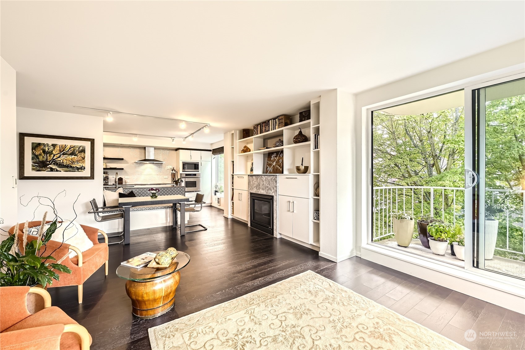 619 5th Avenue West, Unit 401 Seattle, WA 98119 - Photo 4 of 29 a living room with furniture and a large window with wooden floor