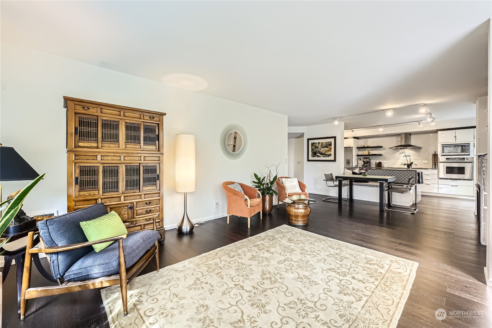 619 5th Avenue West, Unit 401 Seattle, WA 98119 - Photo 5 of 29 a living room with furniture and a table