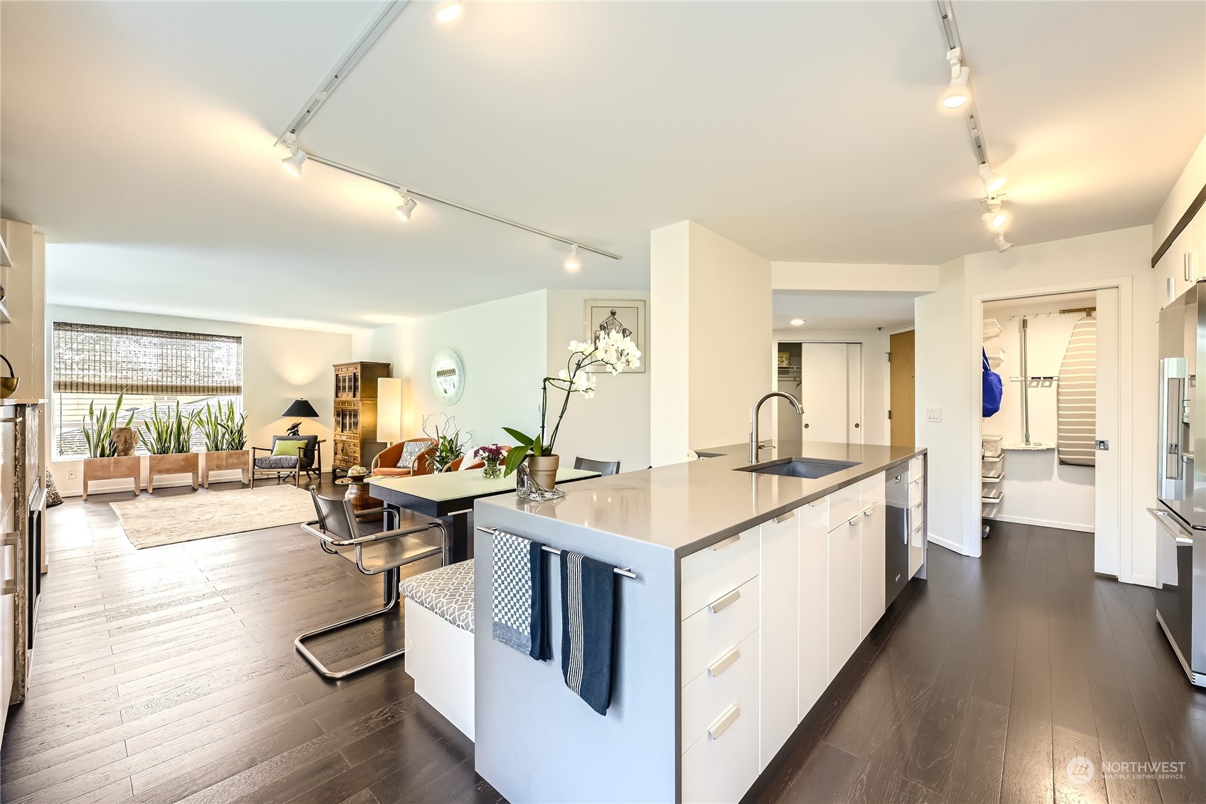 619 5th Avenue West, Unit 401 Seattle, WA 98119 - Photo 7 of 29 a open kitchen with sink stove and cabinets