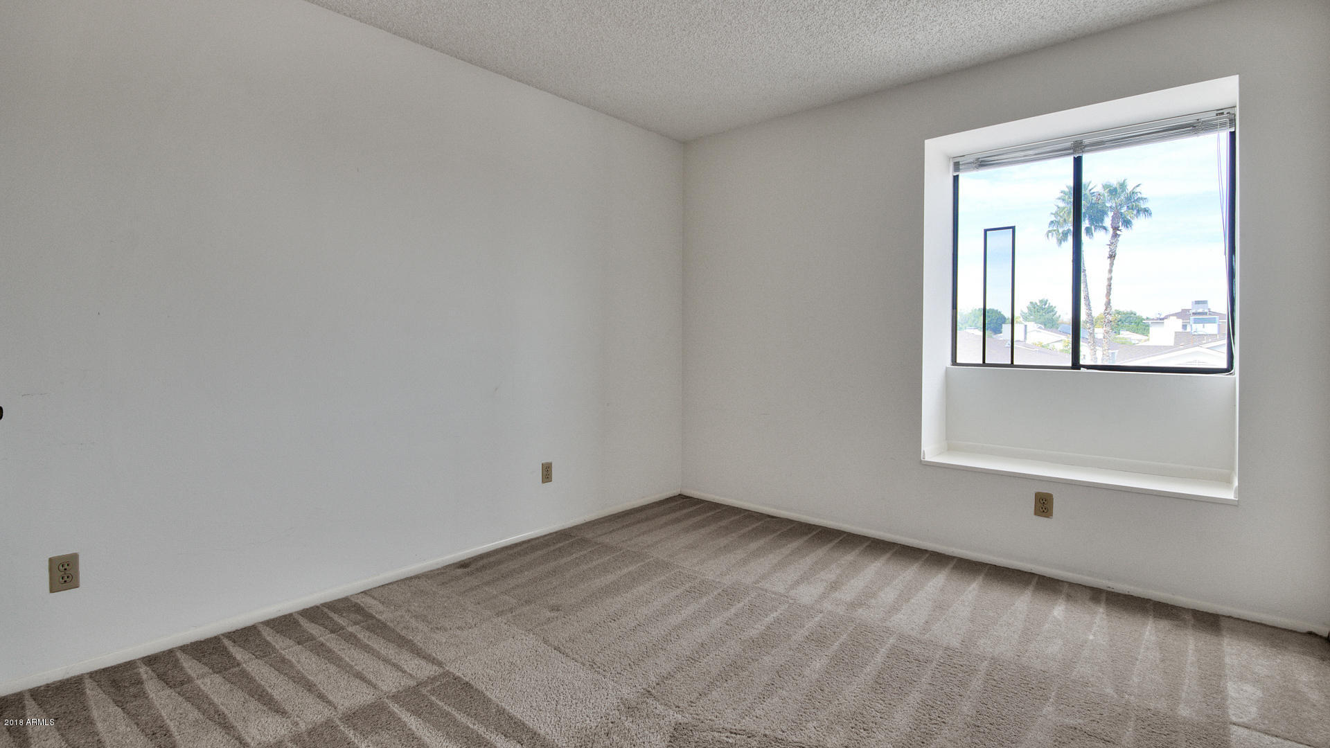 301 West Grandview Road Phoenix, AZ 85023 - Photo 11 of 15 an empty room with a window