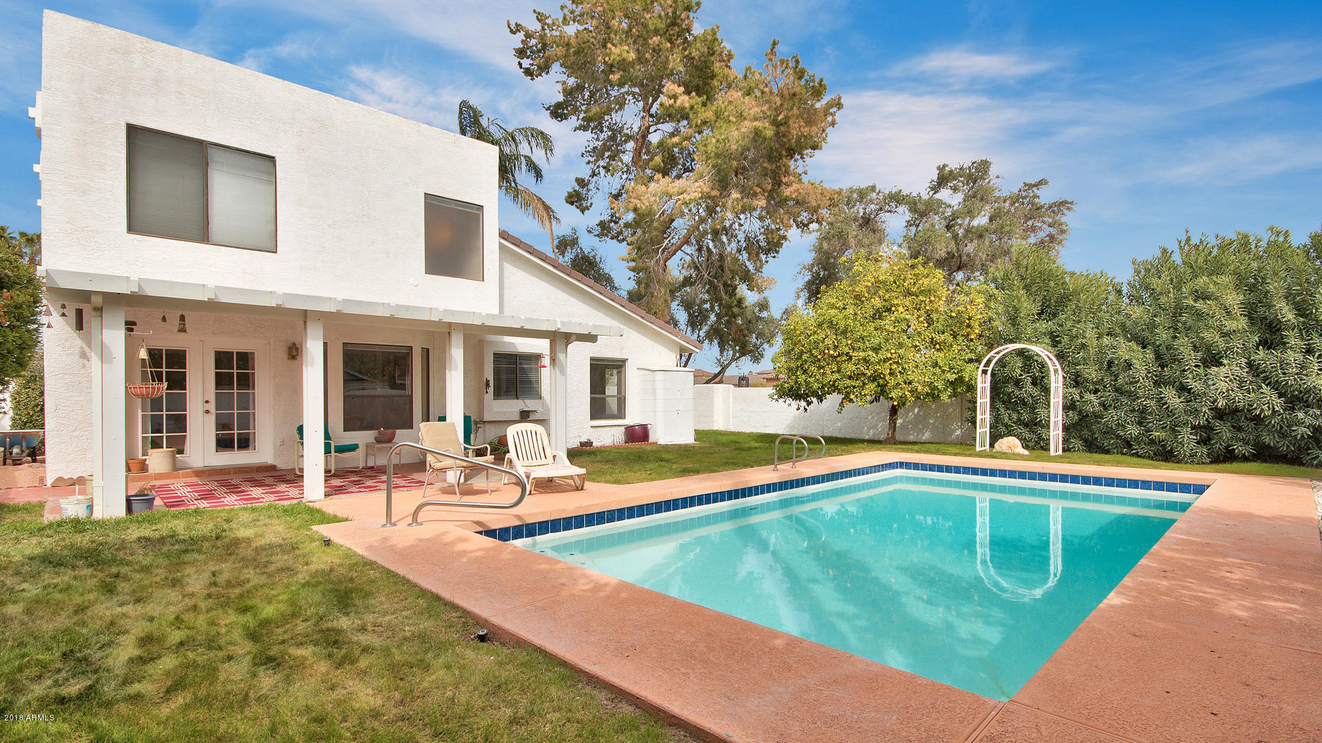 301 West Grandview Road Phoenix, AZ 85023 - Photo 14 of 15 a view of a house with swimming pool and sitting area