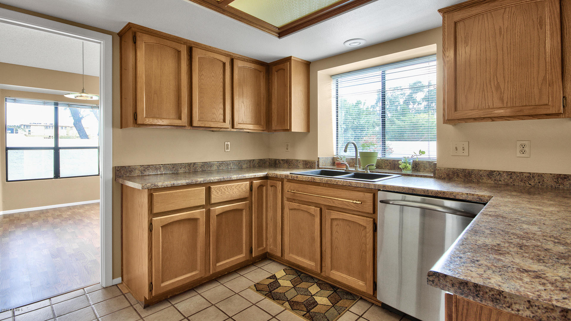 301 West Grandview Road Phoenix, AZ 85023 - Photo 5 of 15 a kitchen with stainless steel appliances granite countertop a sink stove and cabinets