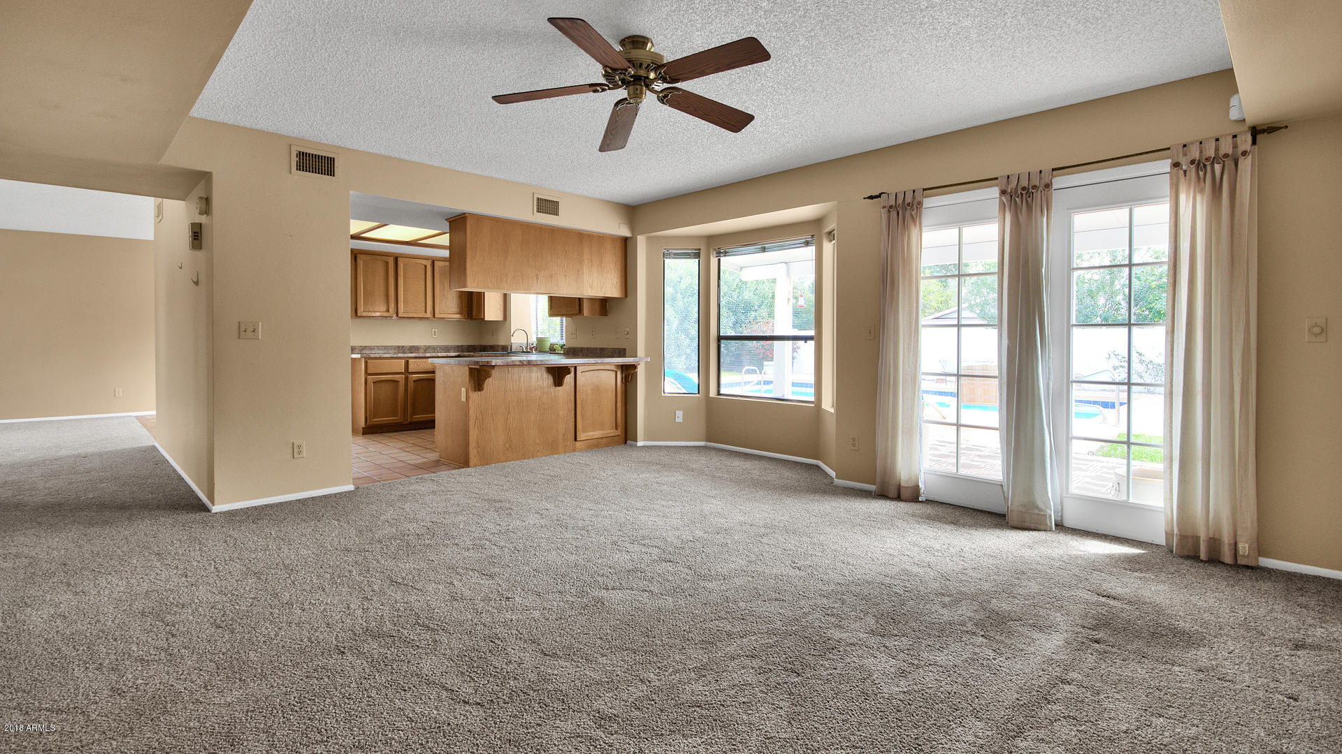 301 West Grandview Road Phoenix, AZ 85023 - Photo 7 of 15 a view of a kitchen with a sink and a refrigerator