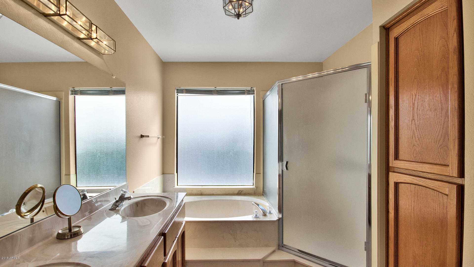 301 West Grandview Road Phoenix, AZ 85023 - Photo 9 of 15 a bathroom with a granite countertop sink and a mirror