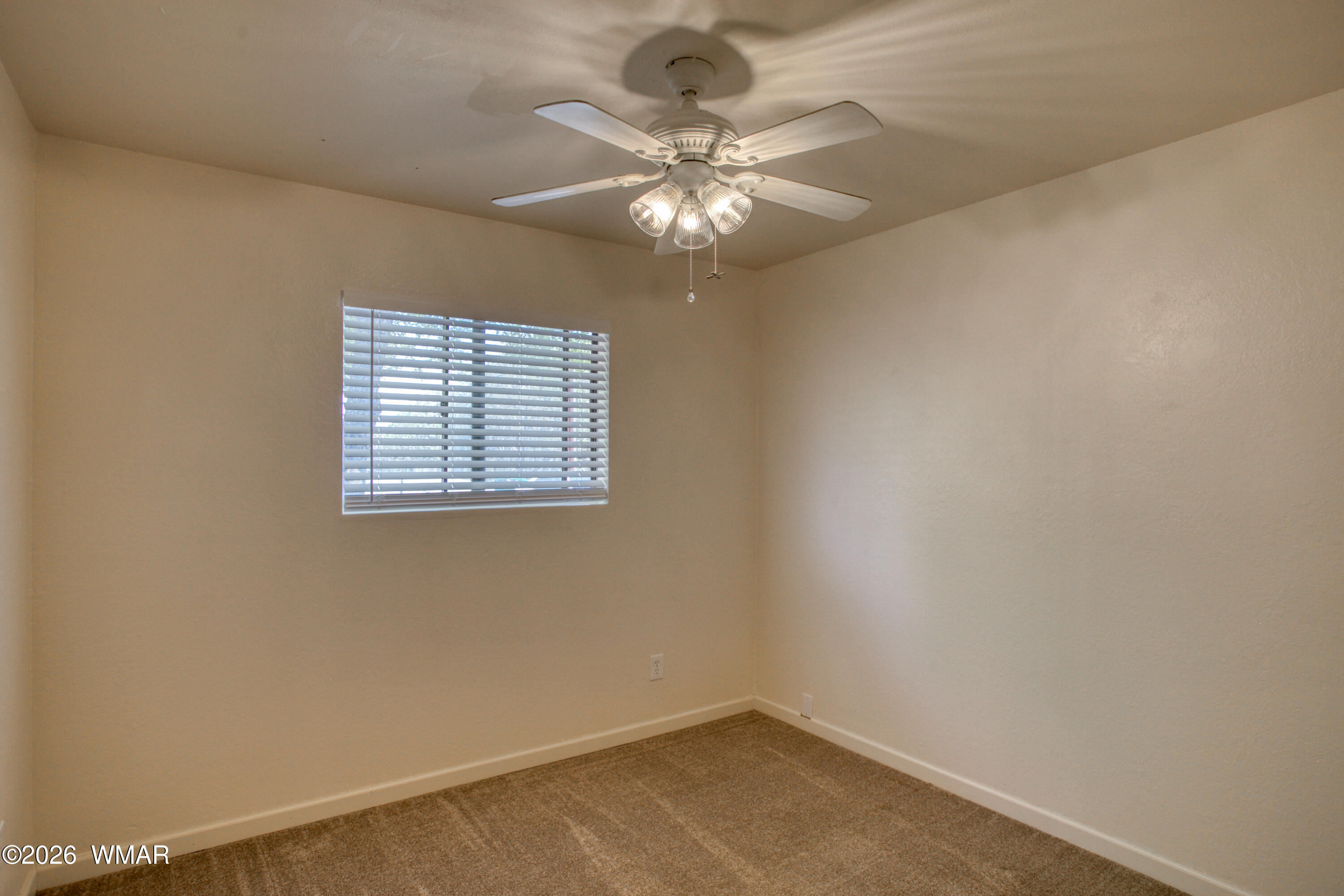 411 West Stratton Show Low, AZ 85901 - Photo 18 of 47 an empty room with a window