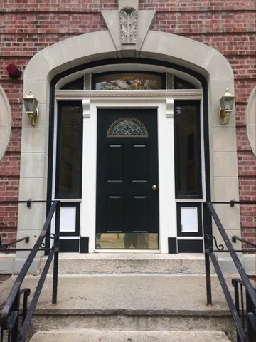 a front view of a building with multiple windows