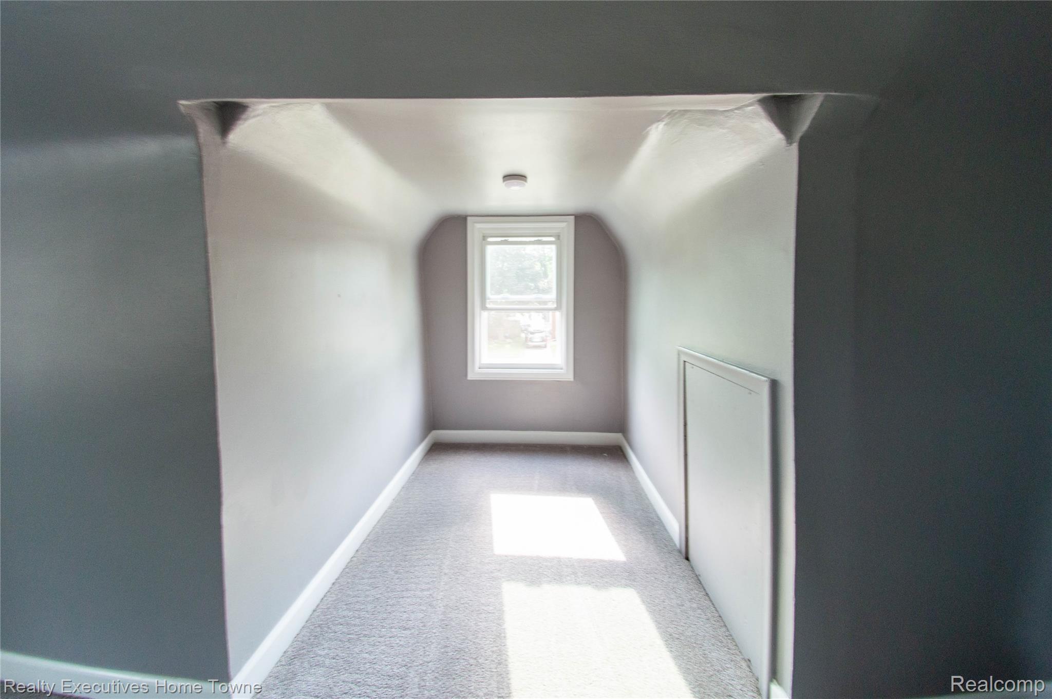 2676 Cumberland Road Berkley, MI 48072 - Photo 17 of 38 Attic space featuring a single window, recessed ceiling light, wall-to-wall carpeting, white baseboards, and a built-in access panel
