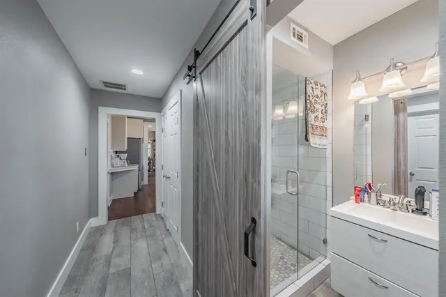 a bathroom with a sink and mirror