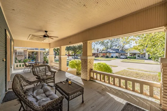 a view of a living room and floor to ceiling window or wooden floor