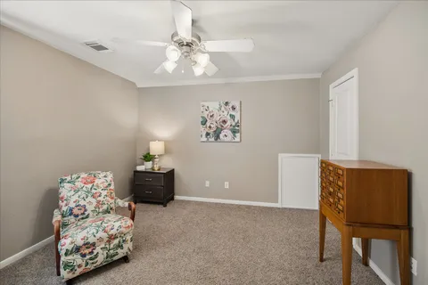 a bedroom with furniture and a chandelier