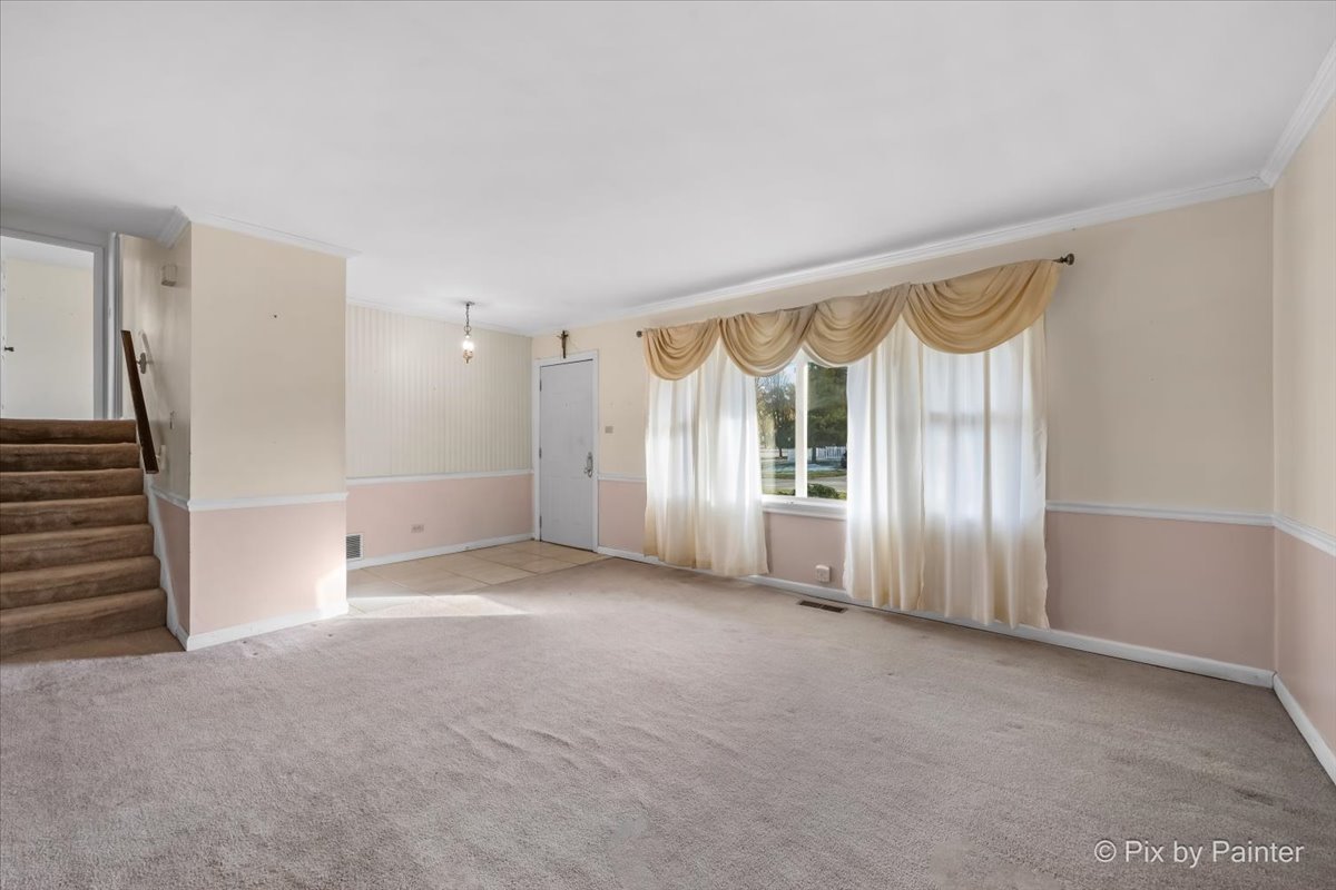 500 Colgate Court Hoffman Estates, IL 60169 - Photo 2 of 28 a view of an empty room with a window
