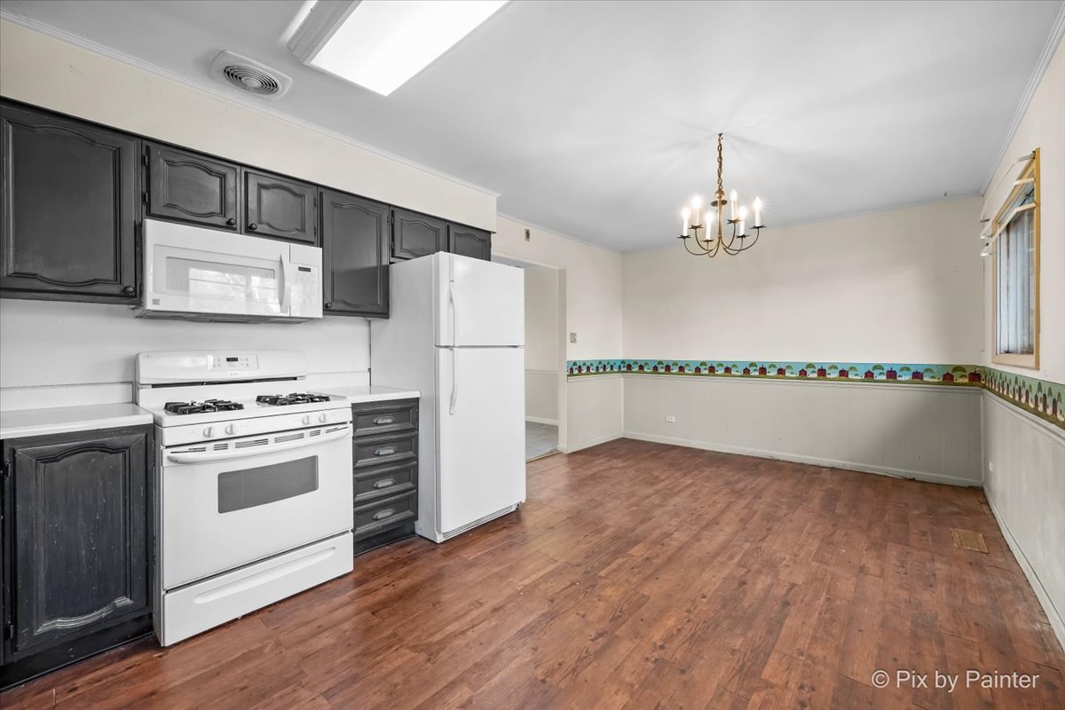 500 Colgate Court Hoffman Estates, IL 60169 - Photo 10 of 28 a kitchen with stainless steel appliances a refrigerator sink and cabinets
