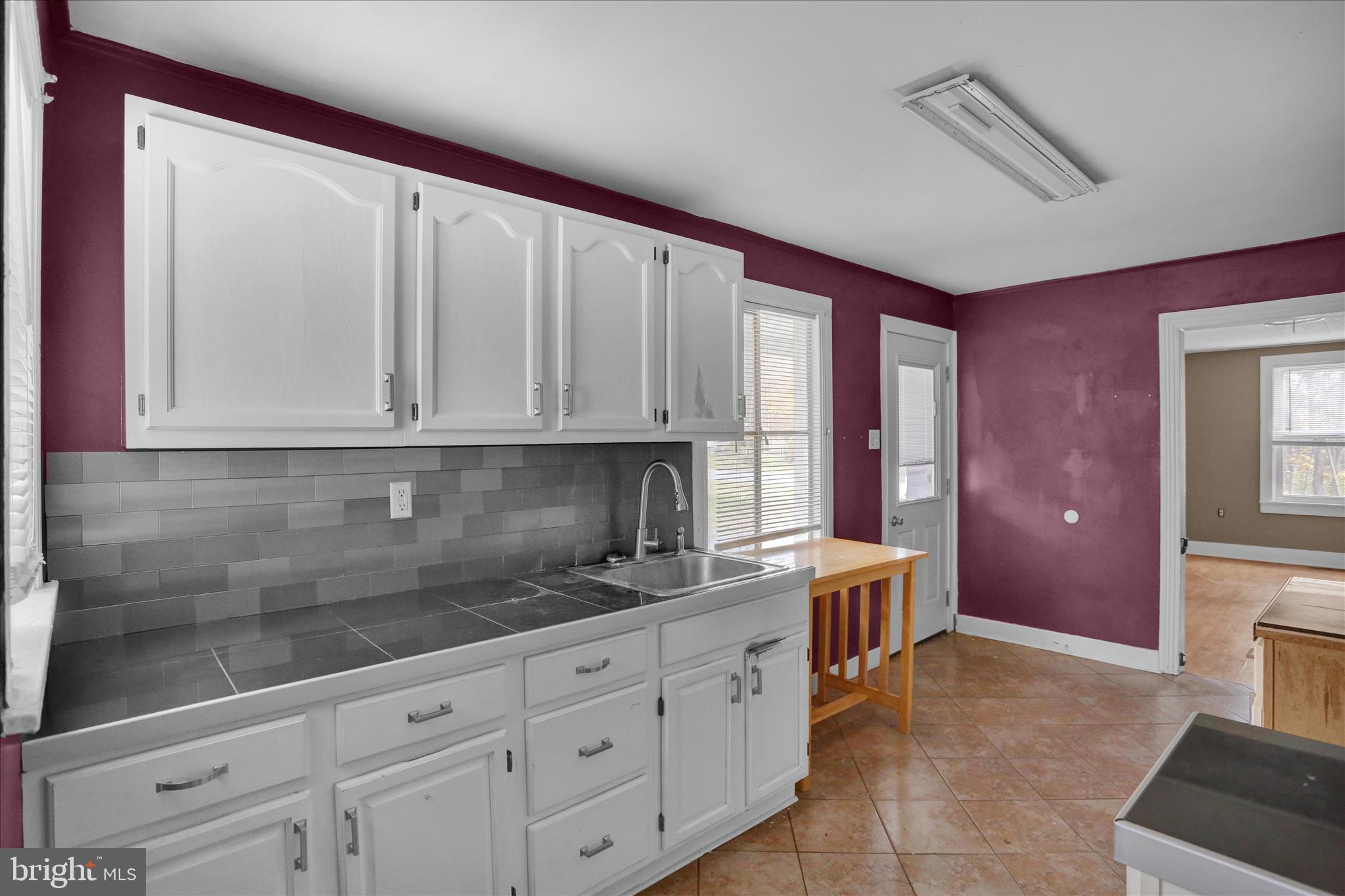 320 South Baumstown Road Birdsboro, PA 19508 - Photo 14 of 43 a kitchen with granite countertop white cabinets and stainless steel appliances