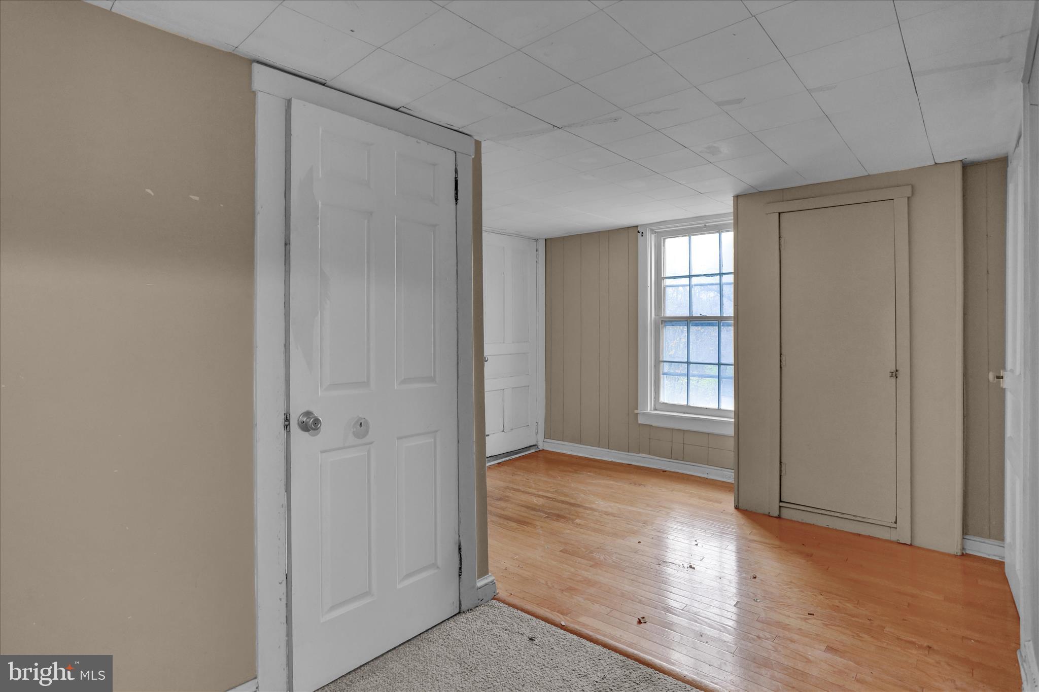 320 South Baumstown Road Birdsboro, PA 19508 - Photo 21 of 43 an empty room with wooden floor and windows