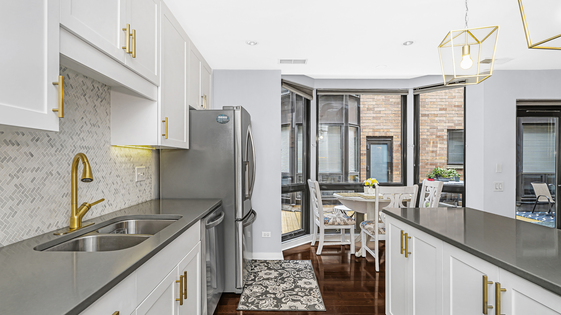 222 South Racine Avenue, Unit 404 Chicago, IL 60607 - Photo 14 of 36 a kitchen with stainless steel appliances a sink stove and refrigerator