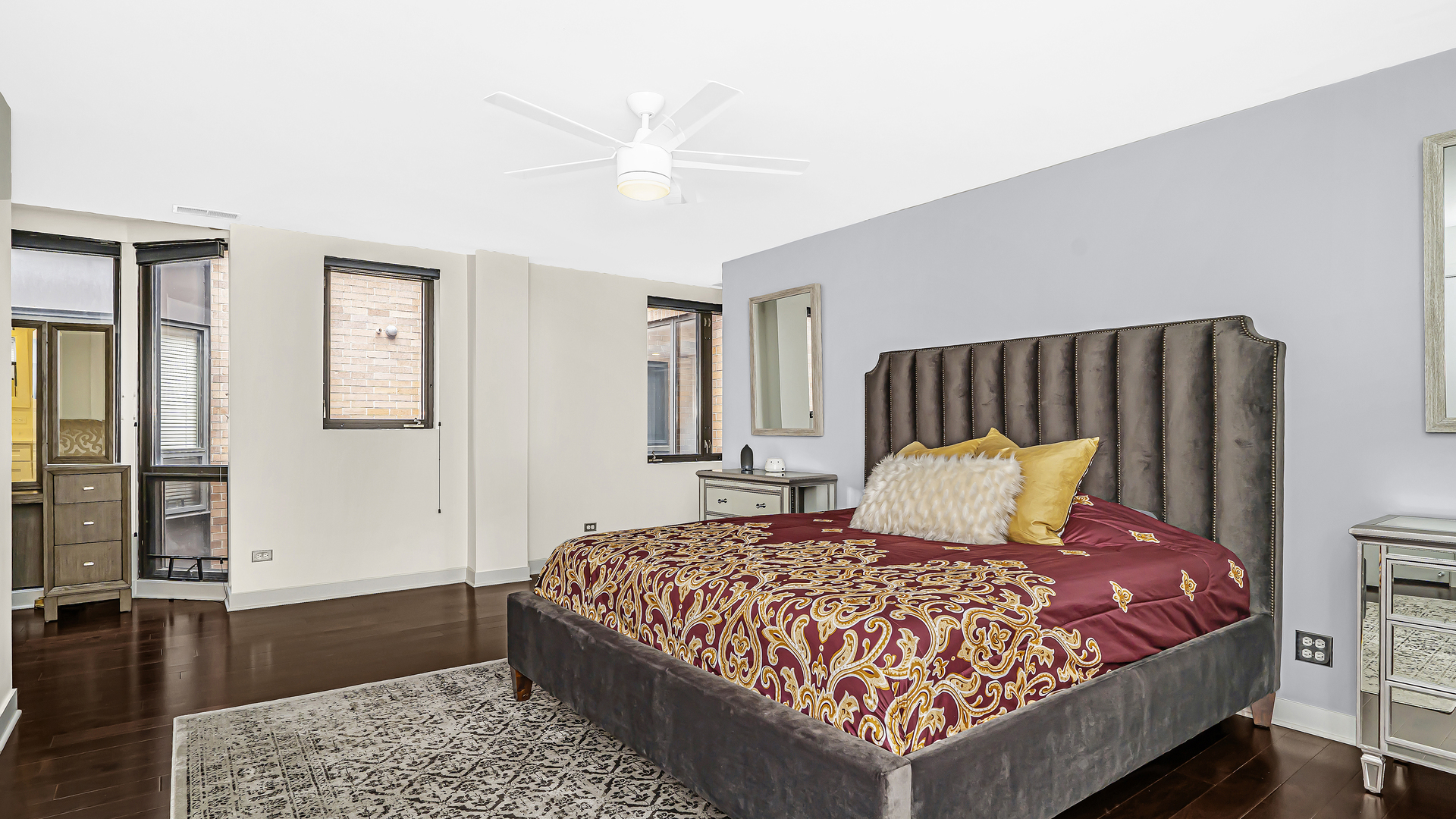 222 South Racine Avenue, Unit 404 Chicago, IL 60607 - Photo 20 of 36 a bedroom with a large bed and a couch