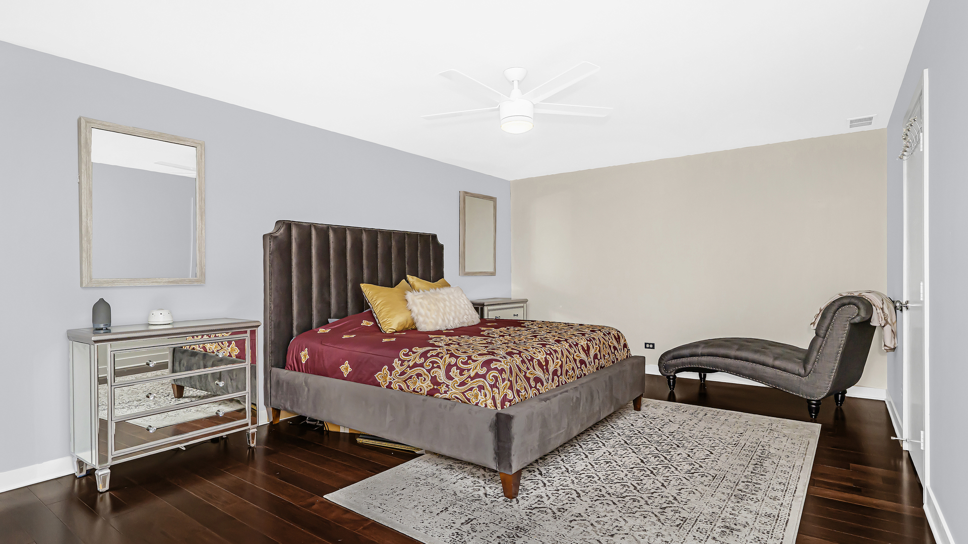 222 South Racine Avenue, Unit 404 Chicago, IL 60607 - Photo 21 of 36 a bedroom with a bed and wooden floor
