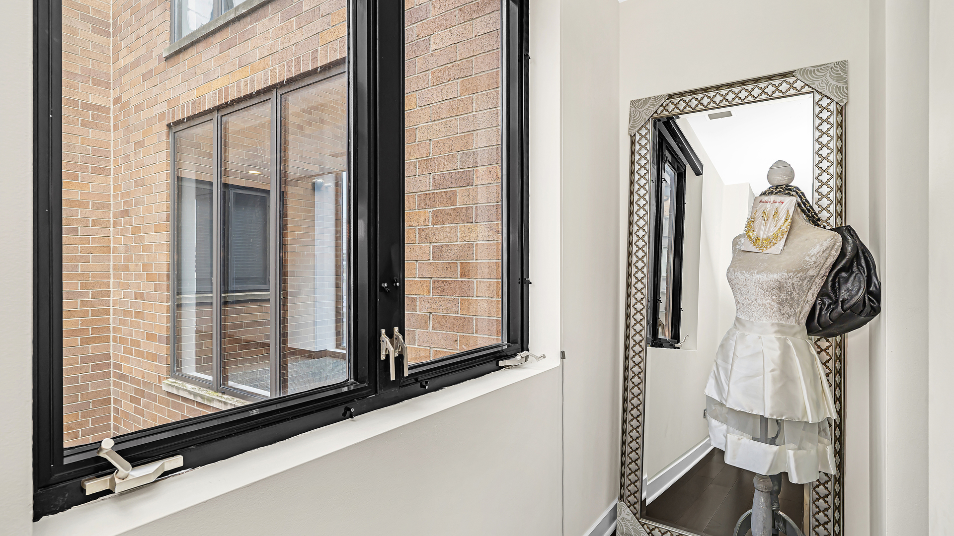 222 South Racine Avenue, Unit 404 Chicago, IL 60607 - Photo 22 of 36 a view of a bathroom with mirror
