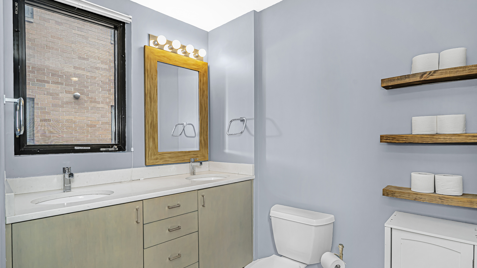 222 South Racine Avenue, Unit 404 Chicago, IL 60607 - Photo 29 of 36 a bathroom with a toilet a sink a vanity and mirror