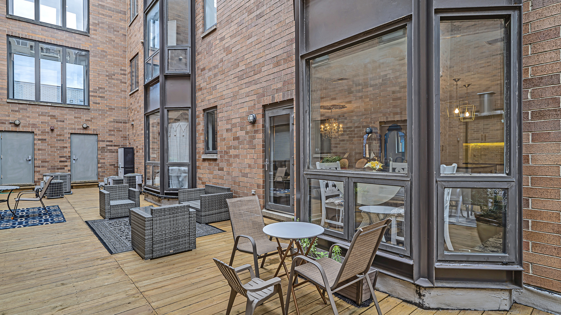 222 South Racine Avenue, Unit 404 Chicago, IL 60607 - Photo 30 of 36 a view of a patio with a table and chairs