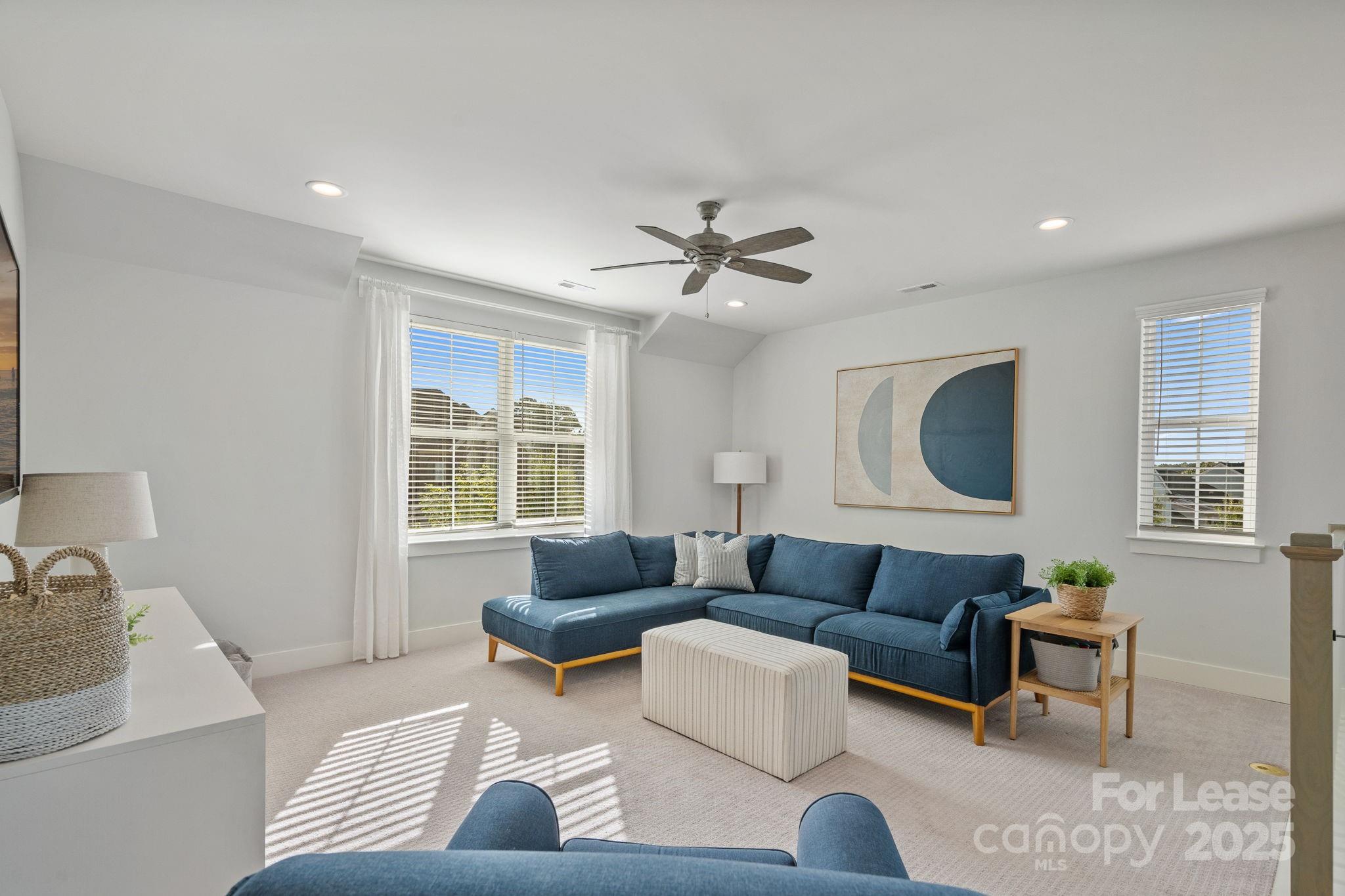 12012 Huntson Reserve Road Huntersville, NC 28078 - Photo 18 of 36 a living room with furniture and a large window