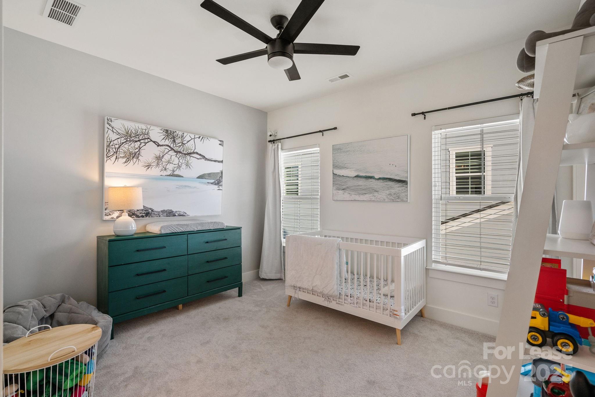 12012 Huntson Reserve Road Huntersville, NC 28078 - Photo 21 of 36 a view of a bedroom with furniture and windows