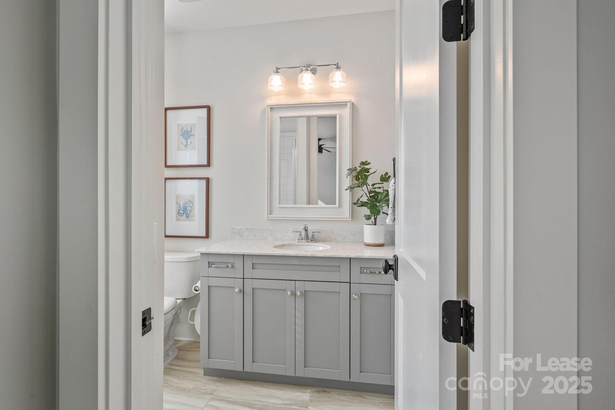 12012 Huntson Reserve Road Huntersville, NC 28078 - Photo 24 of 36 a bathroom with a sink and a mirror