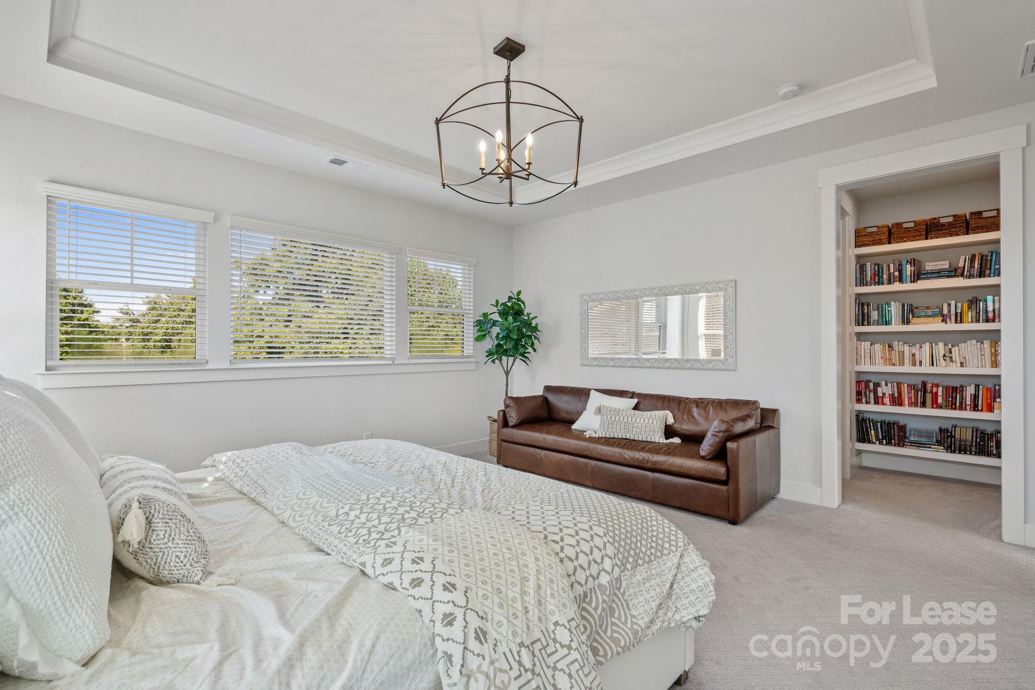 12012 Huntson Reserve Road Huntersville, NC 28078 - Photo 27 of 36 a bedroom with a large bed and a couch