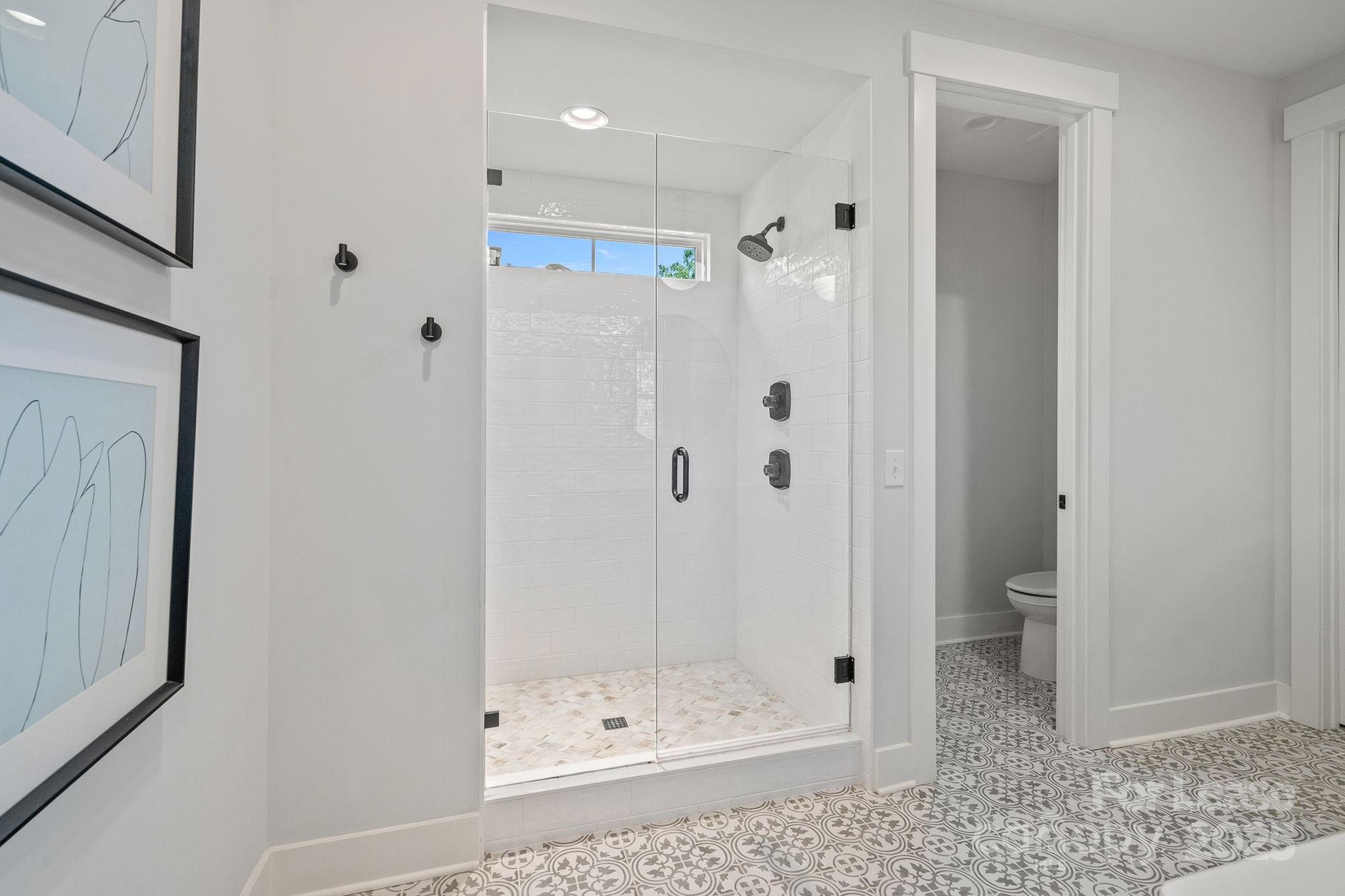 12012 Huntson Reserve Road Huntersville, NC 28078 - Photo 28 of 36 a bathroom with a shower and a toilet