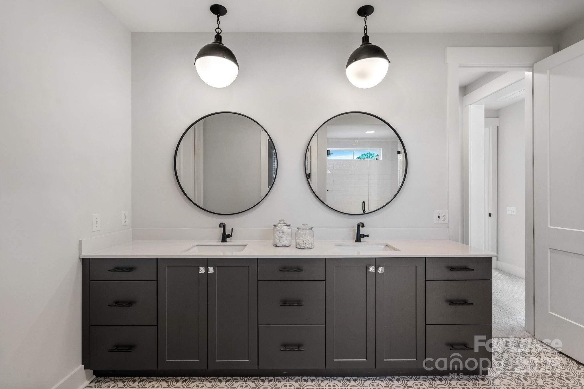12012 Huntson Reserve Road Huntersville, NC 28078 - Photo 29 of 36 a bathroom with a double vanity sink and a mirror