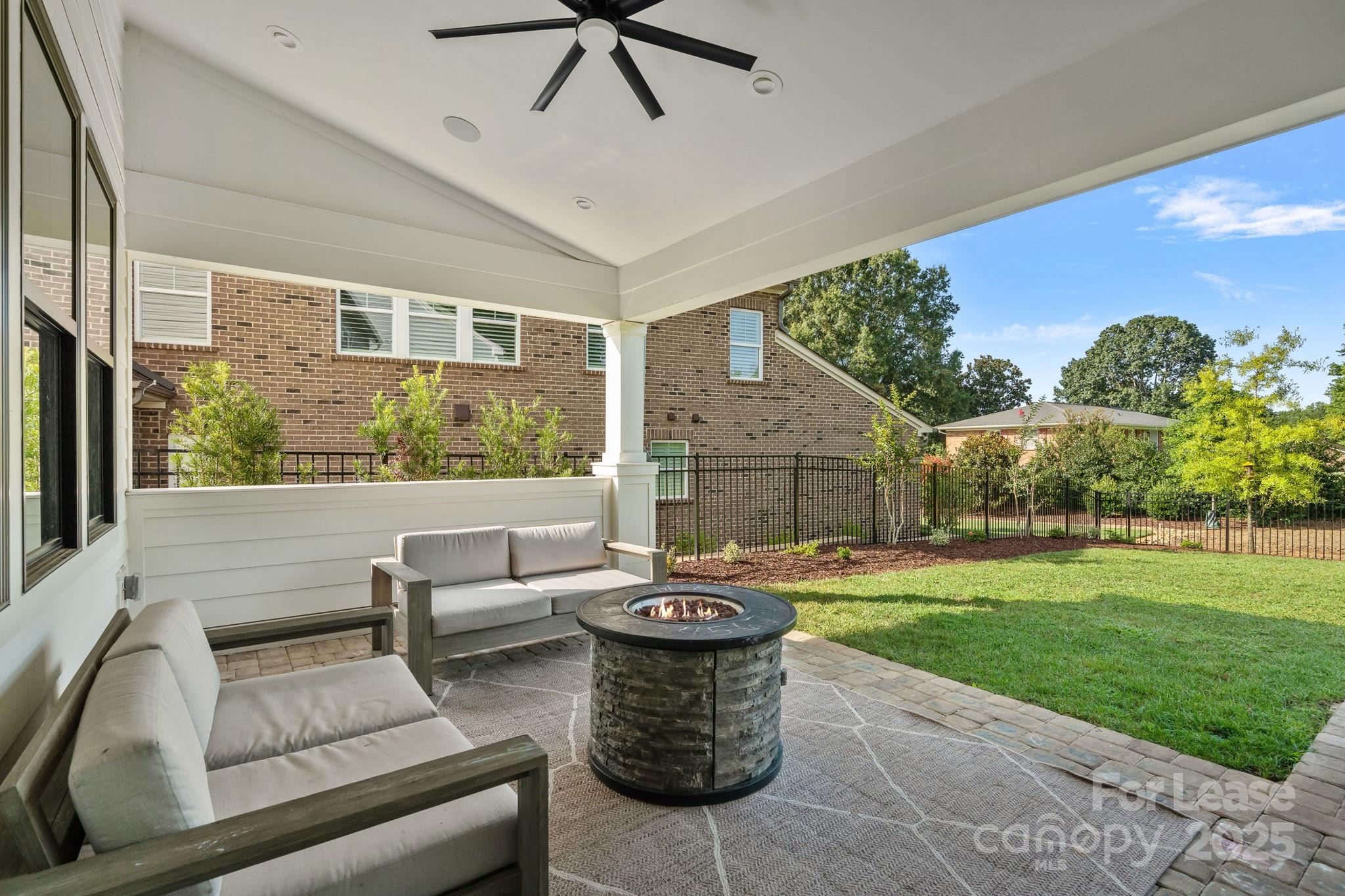 12012 Huntson Reserve Road Huntersville, NC 28078 - Photo 30 of 36 a view of a patio with couches chairs and a yard