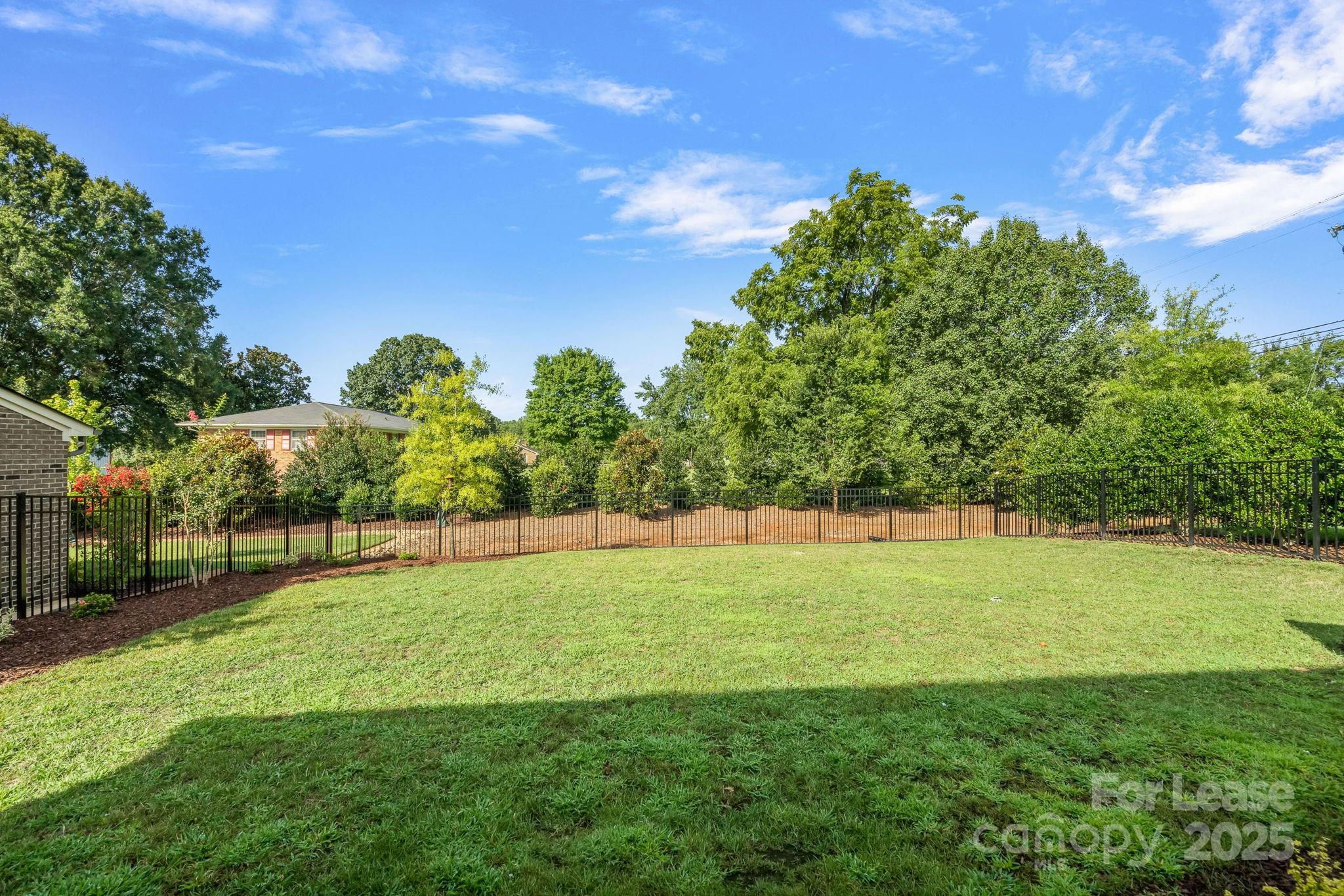 12012 Huntson Reserve Road Huntersville, NC 28078 - Photo 32 of 36 a view of a big yard with a fountain