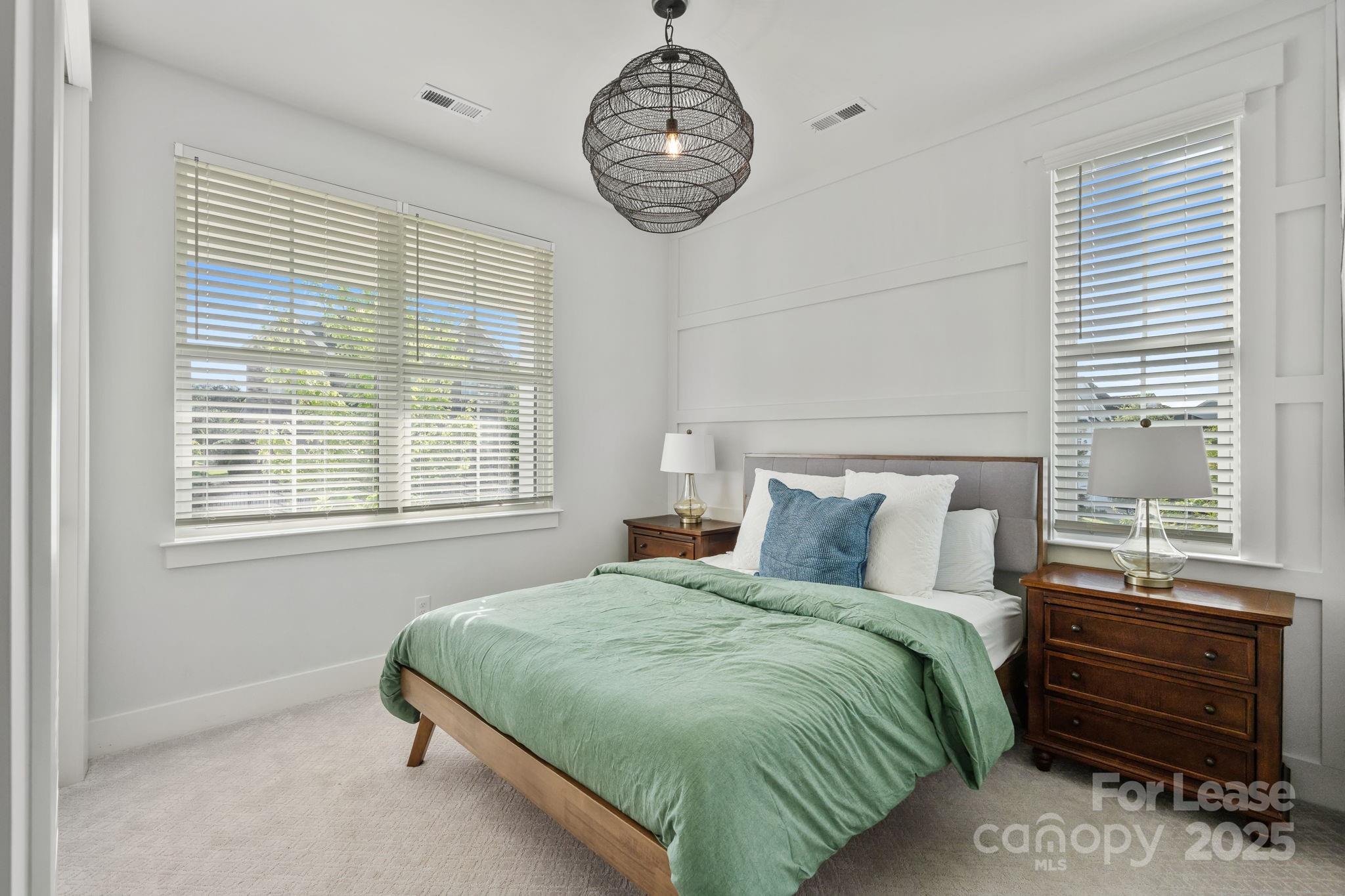 12012 Huntson Reserve Road Huntersville, NC 28078 - Photo 5 of 36 a bedroom with a bed a dresser and a window