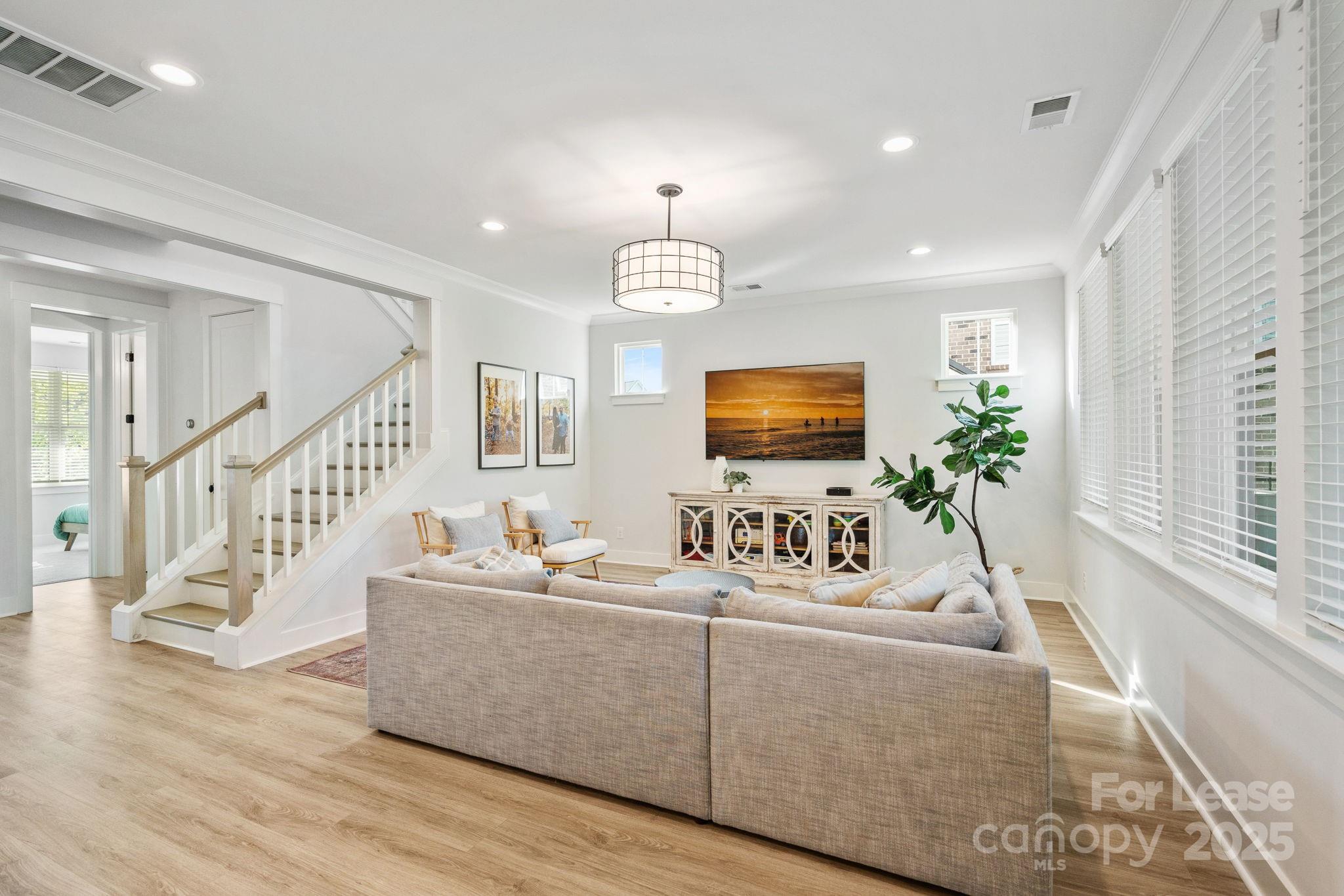12012 Huntson Reserve Road Huntersville, NC 28078 - Photo 8 of 36 a living room with fireplace furniture and a flat screen tv