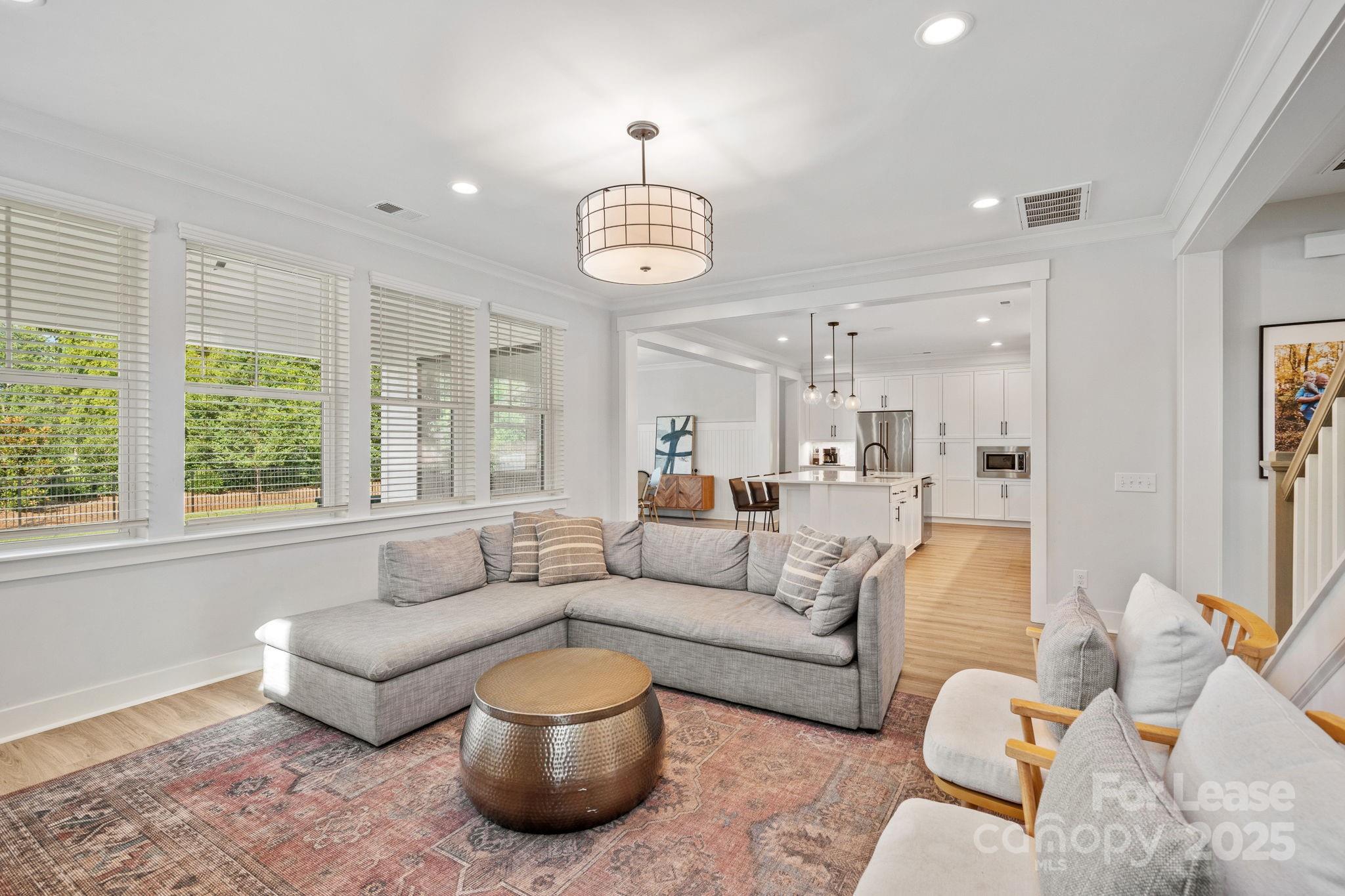 12012 Huntson Reserve Road Huntersville, NC 28078 - Photo 9 of 36 a living room with furniture and a large window