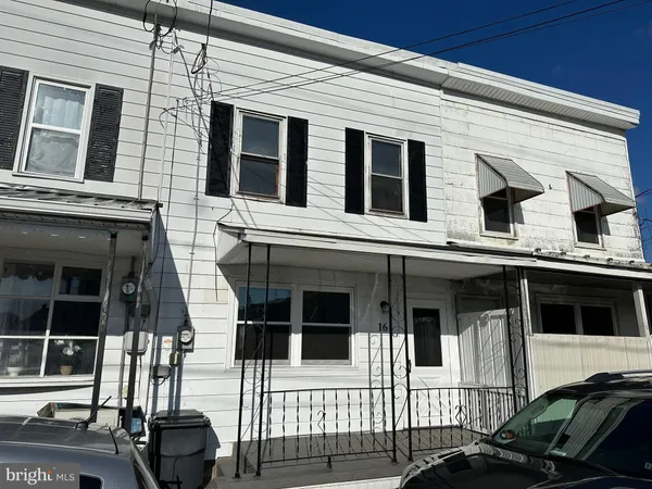 a view of a house with a sink and a window