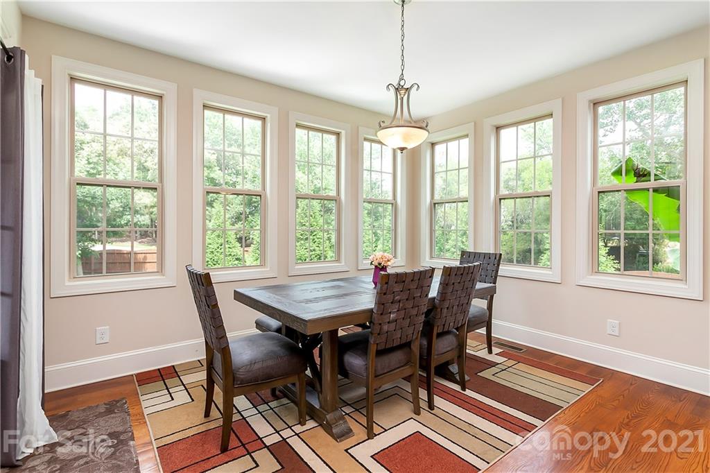 2522 Walker Road Matthews, NC 28105 - Photo 13 of 37 a view of a dining room with furniture window and wooden floor