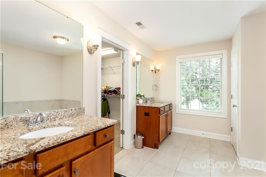 2522 Walker Road Matthews, NC 28105 - Photo 19 of 37 a bathroom with a granite countertop sink and a mirror
