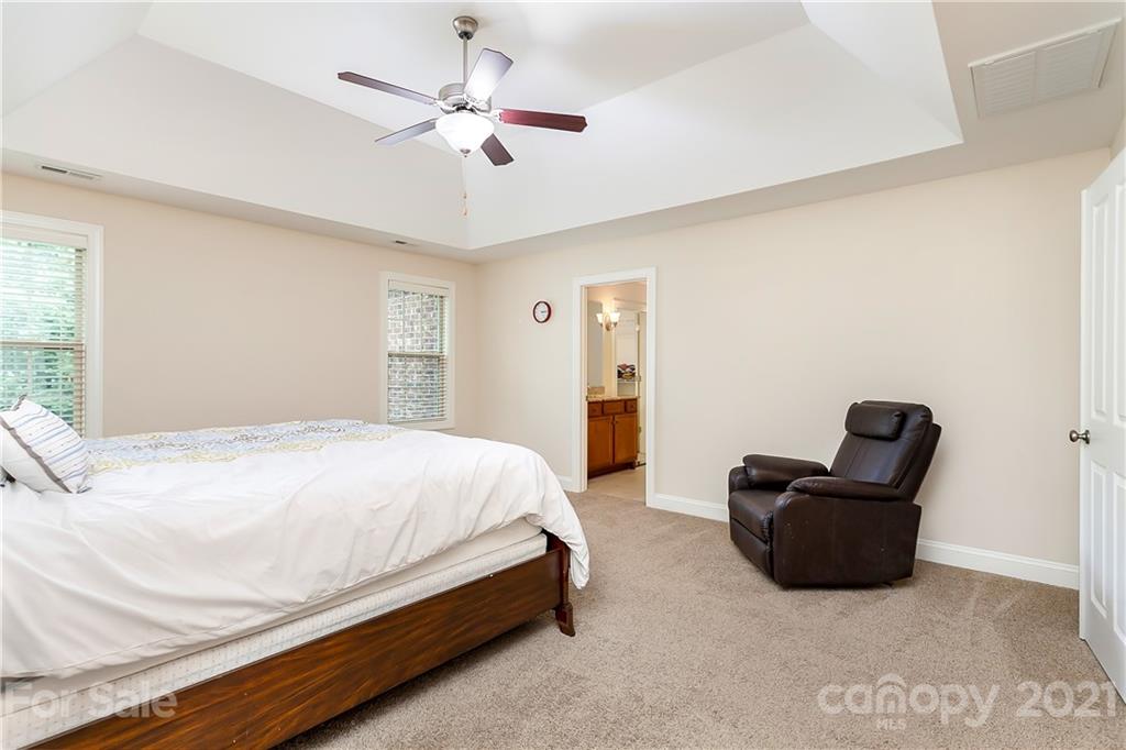 2522 Walker Road Matthews, NC 28105 - Photo 20 of 37 a bedroom with a bed and a couch