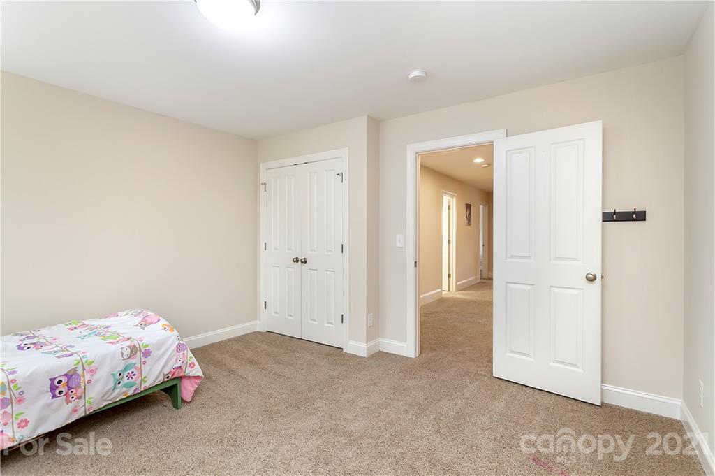 2522 Walker Road Matthews, NC 28105 - Photo 22 of 37 a bedroom with a bed and hallway