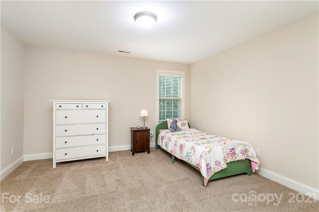 2522 Walker Road Matthews, NC 28105 - Photo 23 of 37 a bedroom with a bed and a dresser