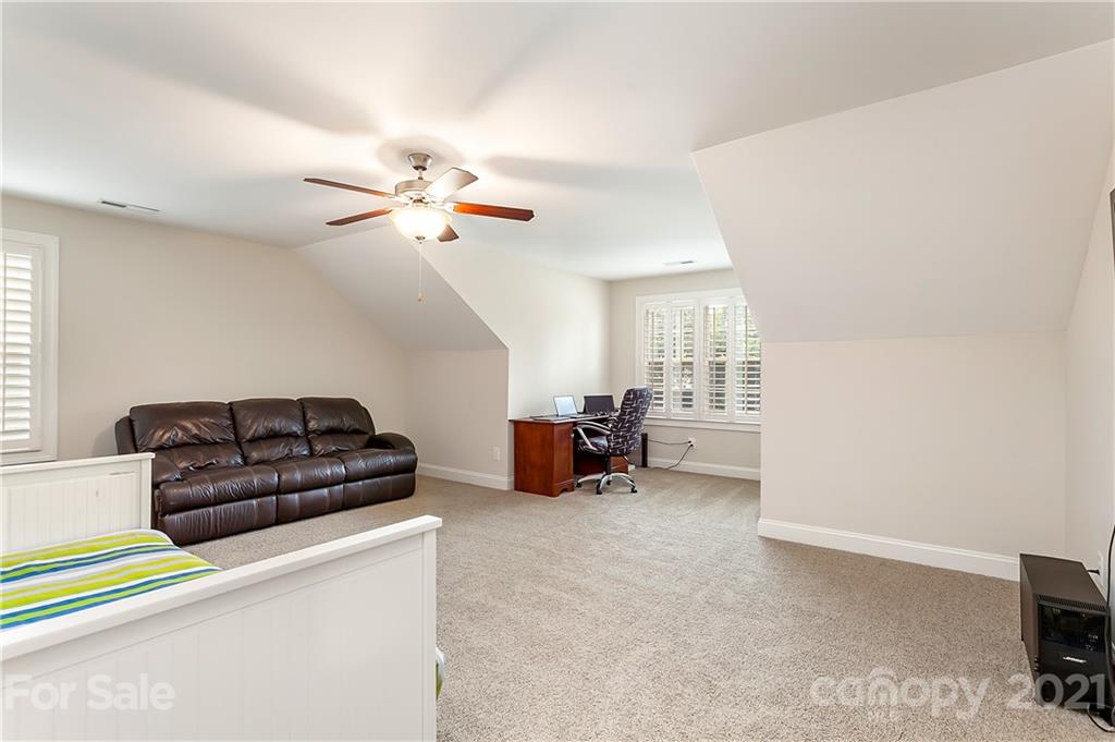 2522 Walker Road Matthews, NC 28105 - Photo 25 of 37 a living room with furniture and a chandelier
