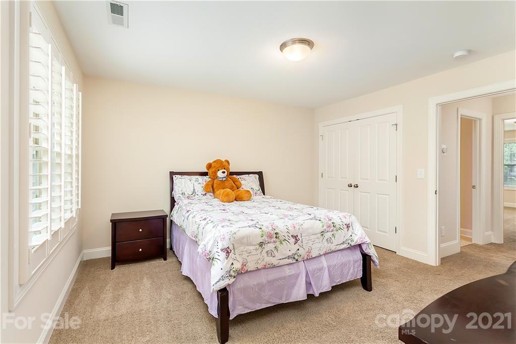 2522 Walker Road Matthews, NC 28105 - Photo 28 of 37 a bedroom with a bed and a window
