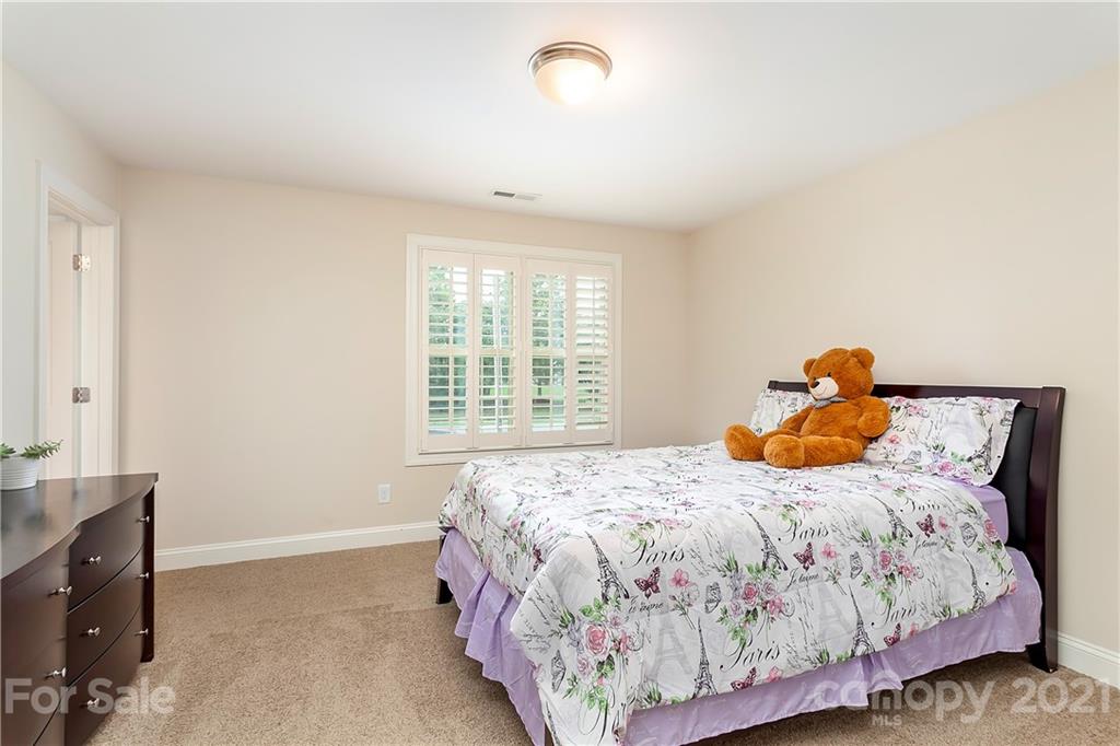 2522 Walker Road Matthews, NC 28105 - Photo 29 of 37 a bedroom with a bed and a window