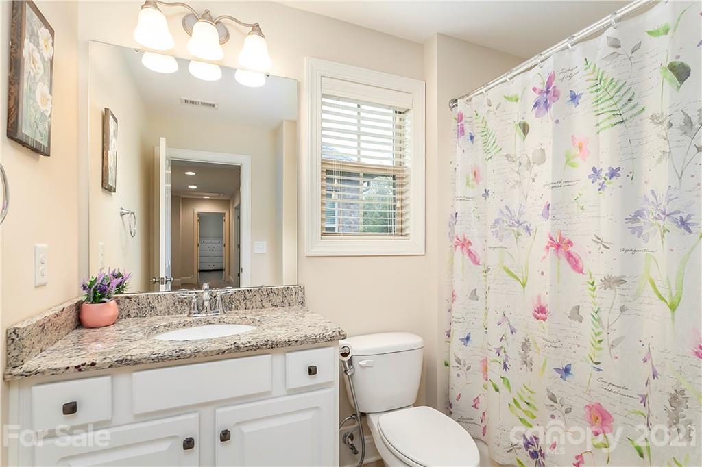 2522 Walker Road Matthews, NC 28105 - Photo 30 of 37 a bathroom with a granite countertop sink a toilet and a mirror