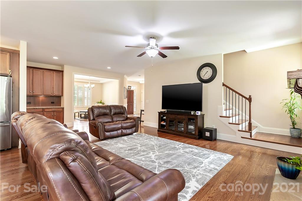 2522 Walker Road Matthews, NC 28105 - Photo 8 of 37 a living room with furniture and a flat screen tv