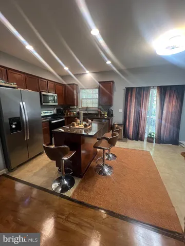 a living room with lots of furniture and appliances