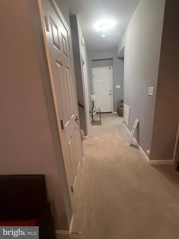 a view of a livingroom with stairs